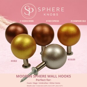 May include: Sphere knobs in reddish brown, rich espresso, champagne gold, gold, and silver. The image shows five metallic sphere wall hooks with screws. The text reads "Sphere Knobs" and "Modern Sphere Wall Hooks". The hooks come in 3 sizes: 2.36", 1.97", and 1.57".