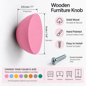 May include: A pink, semi-spherical wooden furniture knob with a matte finish. The knob has a 4 cm diameter and a 2.5 cm projection. A silver M4 screw is included for installation. The text reads Wooden Furniture Knob, Solid Wood, and more.