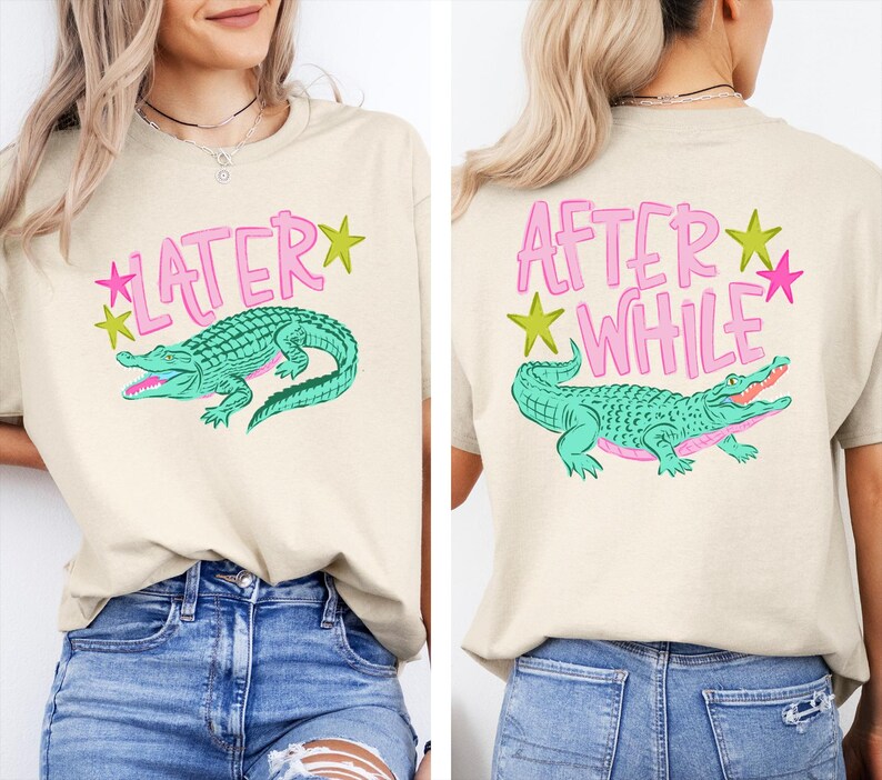 May include: Beige t-shirt with a teal alligator graphic and the word "LATER" in pink on the front. The back of the shirt features the text "AFTER WHILE" and a matching alligator design. Green and pink star accents.
