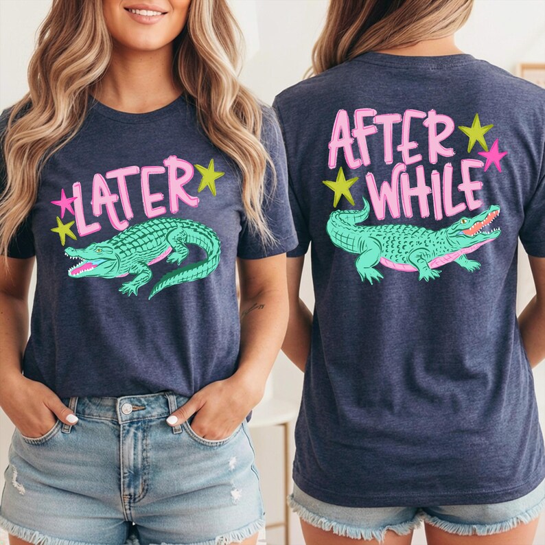 May include: Navy blue t-shirt with a teal alligator graphic and the text "LATER" on the front. The back of the shirt features the text "AFTER WHILE" and a matching alligator design. Pink and yellow accents complete the design.