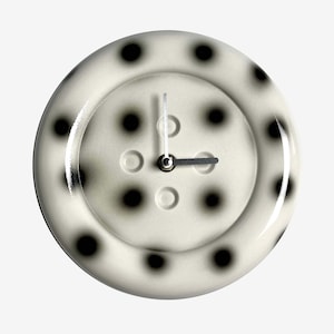 May include: A set of three ceramic mugs with a speckled, matte finish. The mugs are in shades of cream, light brown, and dark brown. Each mug has a simple, minimalist design, perfect for coffee or tea.