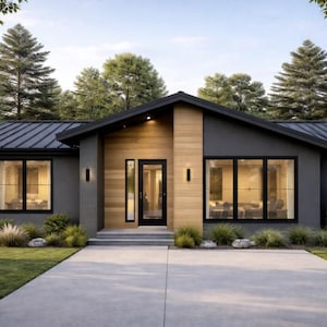 May include: Modern single-story house with a dark gray exterior, black trim, and a wooden front entrance. The house features large windows, a dark metal roof, and is surrounded by lush greenery and a concrete driveway.