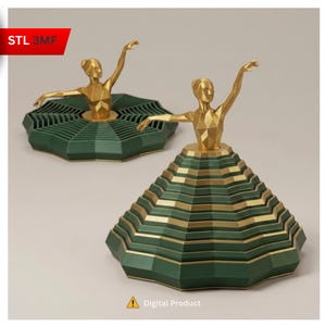 May include: Two geometric ballerina figurines. The figures are gold, with arms outstretched. The skirts are green with gold horizontal stripes. The text "STL 3MF" is in the upper left corner. The text "Digital Product" is at the bottom.