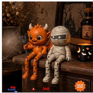 May include: Two articulated figures, one orange devil with horns and a trident, and one beige mummy wrapped in bandages. Both figures have jointed limbs and are sitting upright. The image includes text reading STL Craft HUB, STL 3MF file, and SHOP NOW.