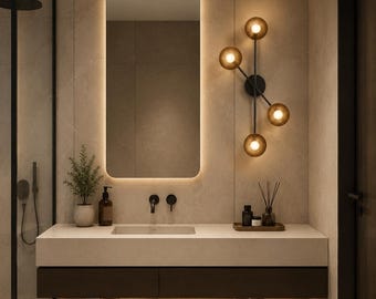May include: Contemporary bathroom design featuring a rectangular illuminated mirror, a dark wood vanity with a stone countertop, and a stylish light fixture. The room includes a shower, a small plant, and a neutral colour scheme.