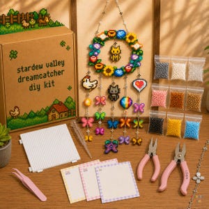May include: A Stardew Valley dreamcatcher DIY kit including a cardboard box with pixel art, a finished beaded wreath with hanging charms, a white pegboard, tweezers, pliers, and small bags of colourful beads for crafting pixelated designs.