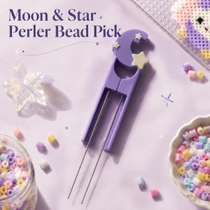 May include: A purple plastic tool for picking up beads, featuring a moon and star design at the top. The text Moon & Star Perler Bead Pick is printed above the tool. Two thin metal prongs extend from the base of the purple handle.
