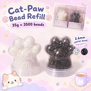 May include: Two clear plastic containers shaped like cat paws, one filled with white 2.6mm perler beads and the other with black 2.6mm perler beads. The text reads Cat-Paw Bead Refill, 35g ≈ 3500 beads, and 2.6mm perler bead (high quality!).