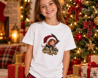 May include: A white short-sleeved t-shirt featuring a graphic of a small elf wearing a red Santa hat, peeking out from a zipper opening. The text below the elf reads "Is it time yet?" in a decorative, gold-colored script font.