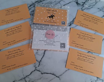 May include: A collection of orange cards with black text, some in clear plastic sleeves. One card has a horse graphic and the text "THE SIGN Race Day". Other cards have phrases like "I think I've just spotted today's real winner".