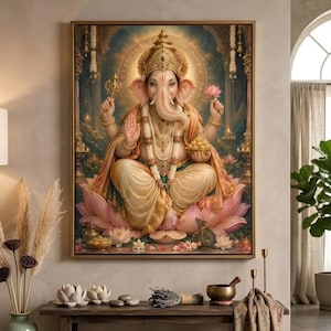 May include: A framed wall art print depicting the Hindu deity Ganesha seated in a lotus position on a large pink lotus flower. Ganesha wears ornate gold jewelry, a crown, and robes, holding a trident and a lotus flower with a small mouse nearby.