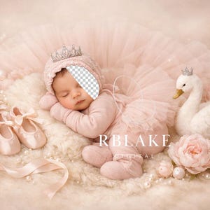 May include: A baby in a pink outfit, wearing a crown, lies asleep amidst a tutu, ballet shoes, and a swan ornament. The scene is adorned with pearls, ribbons, and flowers, creating a soft, dreamy aesthetic.