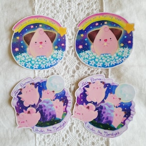 May include: Four stickers featuring cartoon characters. Two stickers show a pink character with the text "wishing on a falling star...". The other two stickers show pink characters with the text "Let's Dance... Under the Moonlight..."