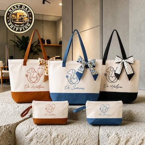 May include: Three canvas tote bags and two matching pouches in brown, blue, and black. Each features a line art graphic of a dog, cat, and stethoscope with a name printed below. The bags have decorative bows on the straps and solid colored bases.