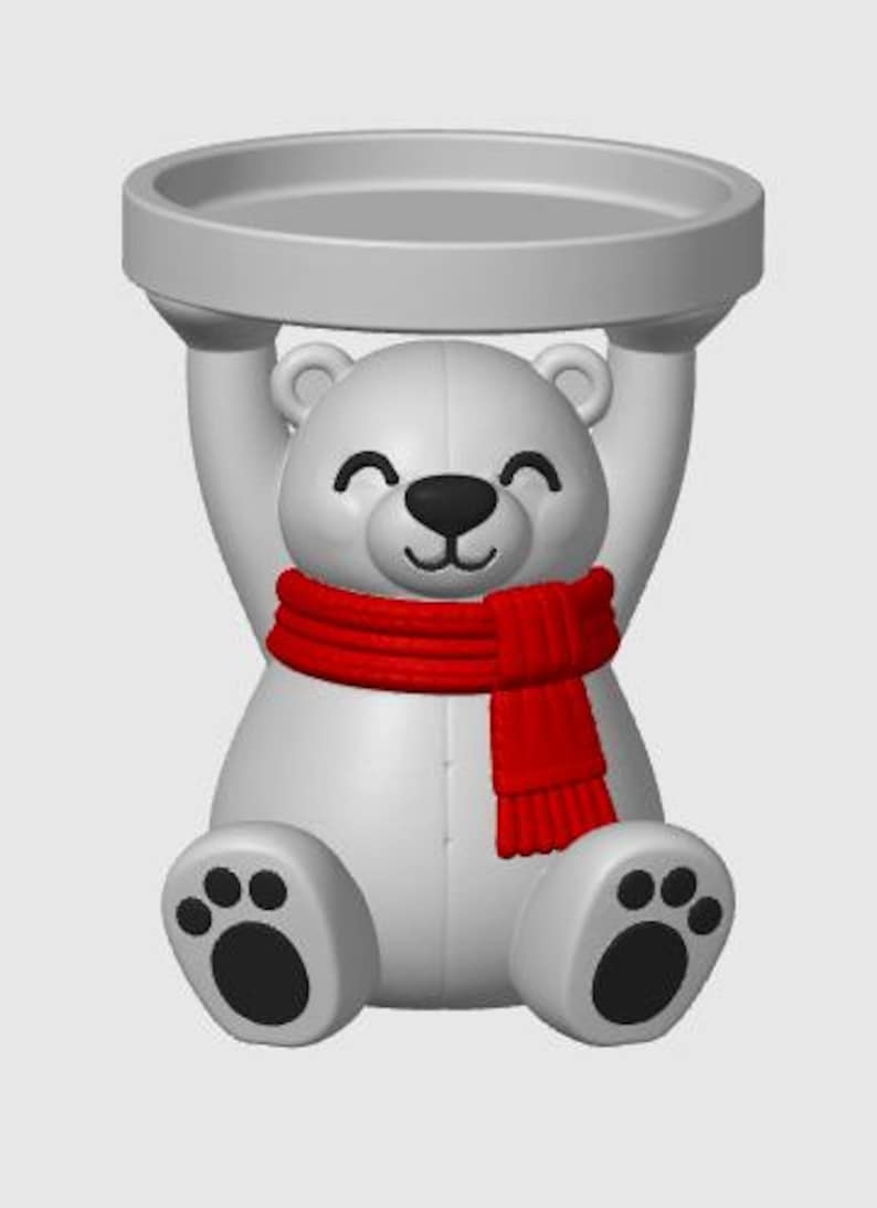 May include: A white polar bear figurine with a black nose and paw pads, wearing a bright red scarf. The bear is in a seated position with its arms raised above its head, supporting a circular, flat-topped tray in a matching white finish.