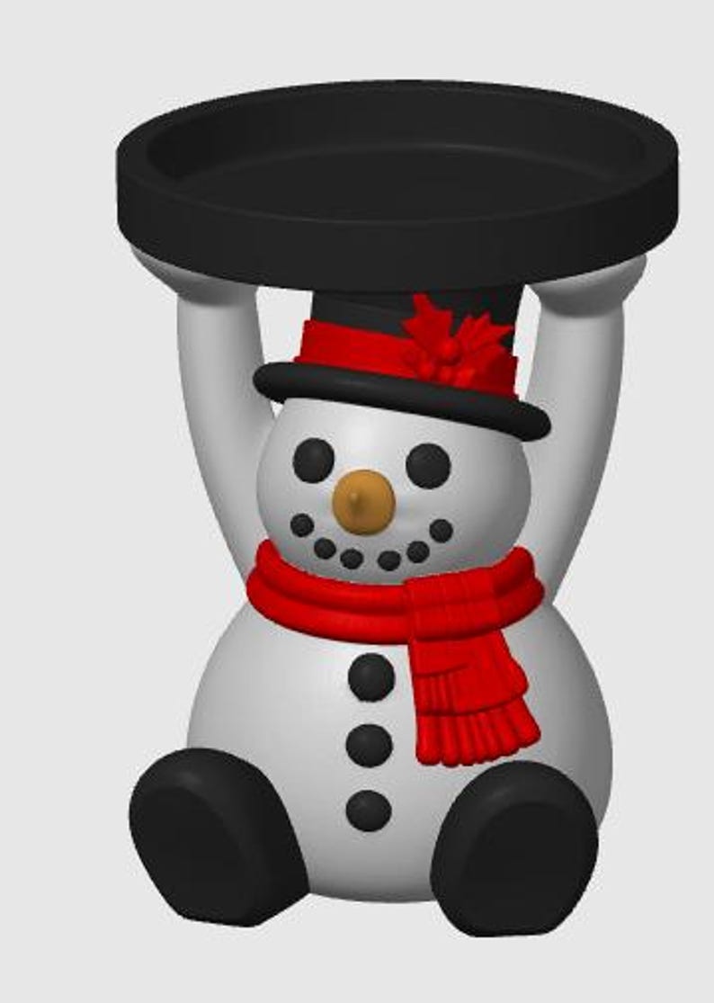May include: A white snowman figurine with a black top hat featuring a red band and holly, a red scarf, and black buttons. The snowman is sitting with arms raised, supporting a circular black tray above its head. The snowman has a tan nose.