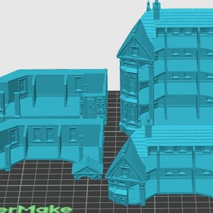 Puede incluir: Un modelo azul claro impreso en 3D de un edificio de varios pisos, mostrado en secciones modulares separadas. Las piezas muestran detalles arquitect&oacute;nicos que incluyen ventanas, l&iacute;neas de techo y estructuras de pared sobre una cuadr&iacute;cula digital.