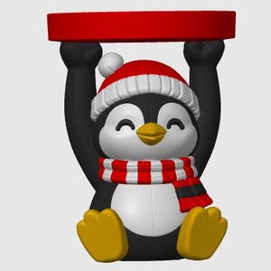 May include: A decorative penguin figurine featuring a black and white body, yellow feet, and a yellow beak. The penguin wears a red and white winter hat with a pom-pom and a red and white striped scarf, while holding a red circular tray overhead.