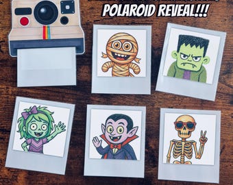 May include: A Halloween Characters Polaroid Reveal set featuring a camera cutout and five square cards with illustrations of a mummy, Frankenstein's monster, a zombie, a vampire, and a skeleton. Text reads HALLOWEEN CHARACTERS POLAROID REVEAL!!! and 16 ITEMS + FRAMES + HALLOWEEN STICKERS.