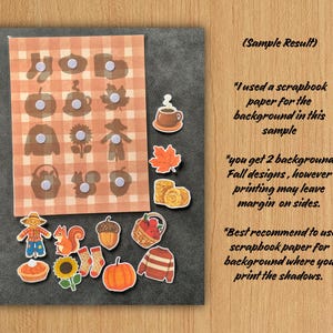 May include: A set of autumn-themed stickers featuring a scarecrow, squirrel, acorn, basket of apples, pumpkin, sunflower, sweater, socks, pie, and coffee mug, displayed alongside a plaid background sheet with corresponding shadow silhouettes.