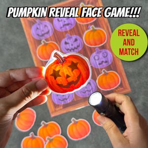 May include: A Pumpkin Reveal Face Game activity sheet featuring orange and purple pumpkin illustrations. A flashlight illuminates a die-cut orange pumpkin sticker with star-shaped eyes and a jagged mouth, revealing a hidden face design.