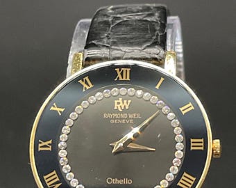 Reloj Raymond Weil Othello vintage con esfera negra, correa de cuero con detalles de diamantes y baño de oro de 18 quilates.