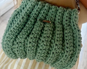 Black envelope clutch with silver accessories.