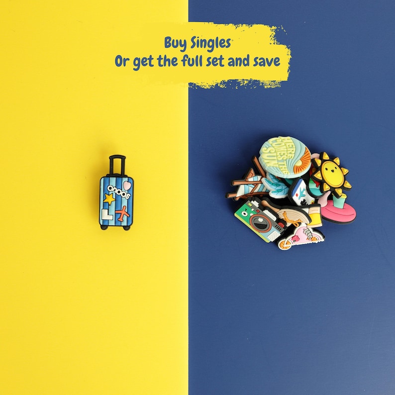 May include: A blue striped suitcase charm with a yellow star and red airplane icon, alongside a collection of colorful summer-themed charms including a camera, sun, and beach chair. Text reads: Buy Singles Or get the full set and save.