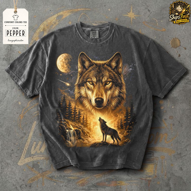 May include: Dark gray Comfort Colors tee featuring a detailed illustration of a wolf's face and a howling wolf against a starry night sky. The shirt includes the text "COLOR: PEPPER" on a tag.