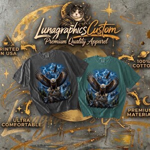 May include: Two t-shirts, one charcoal gray and one teal, feature an eagle design with a blue sky and lightning. The shirts are labeled "Lunagraphics Custom Premium Quality Apparel", "Printed in USA", "100% Cotton", "Ultra Comfortable", and "Premium Material".