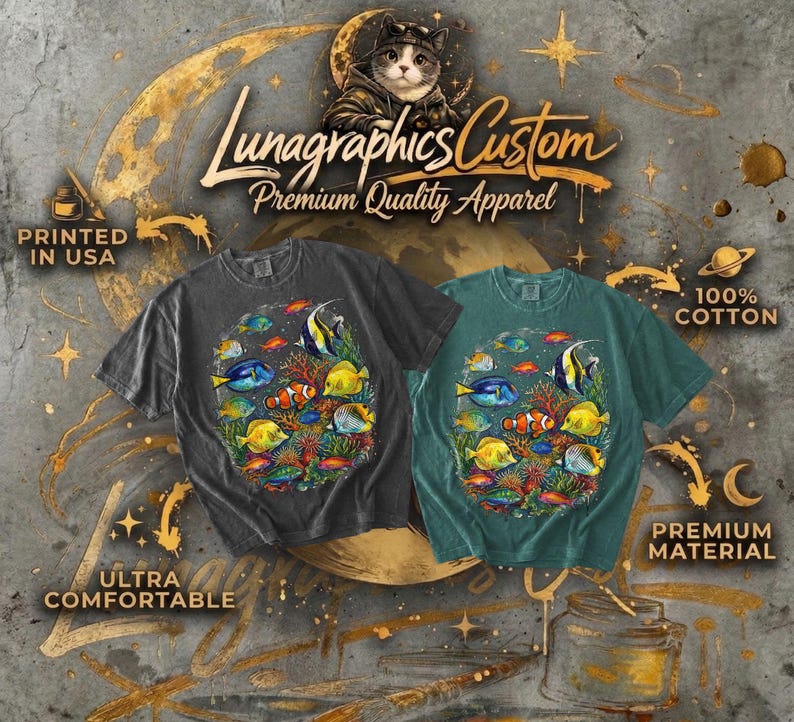May include: Two t-shirts, one charcoal and one teal, feature a colorful underwater scene with various fish. The shirts are labeled "Lunagraphics Custom Premium Quality Apparel" and are made of 100% cotton. The shirts are printed in the USA and are ultra comfortable.