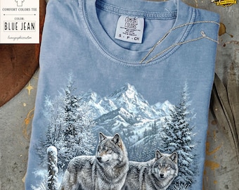 Chemise montagnes loup des neiges d'hiver, t-shirt graphique rétro loup arctique couleurs confort, t-shirt vintage montagne enneigée, haut nature hivernale, cadeau loup