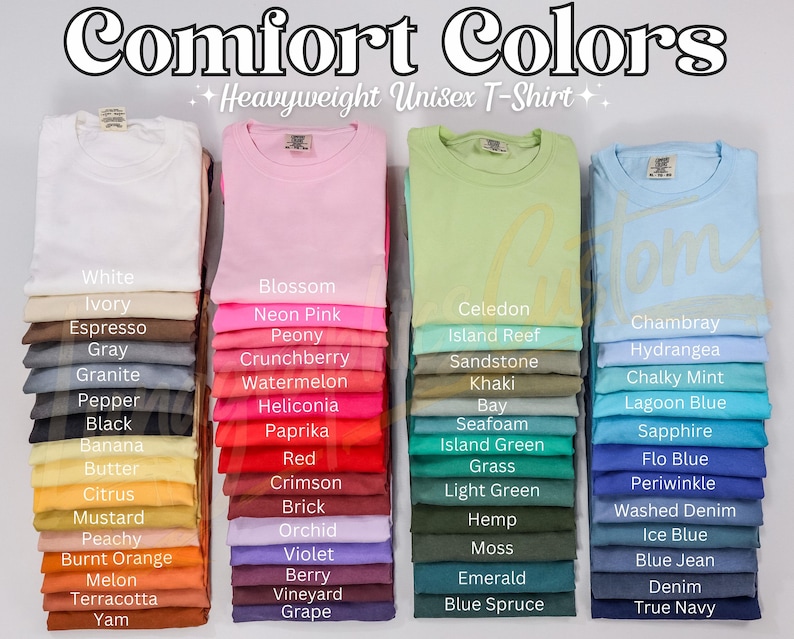 May include: A selection of Comfort Colors heavyweight unisex t-shirts in a variety of colours, including white, pink, green, and blue. The image showcases a wide spectrum of shades, from light pastels to vibrant tones, with colour names displayed below each stack.