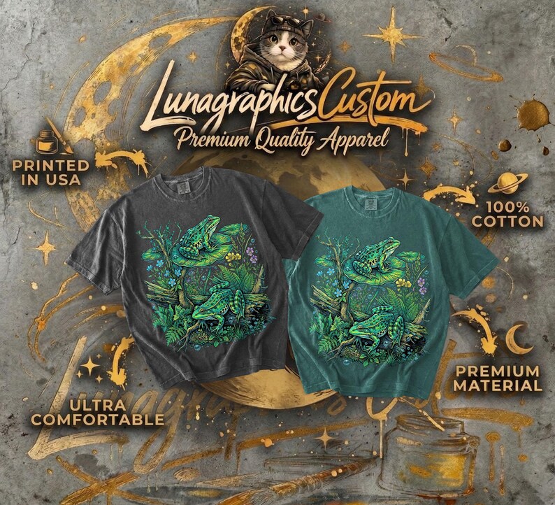 May include: Two t-shirts, one charcoal and one teal, feature a vibrant frog design. The shirts, labeled "Lunagraphics Custom," are made of 100% cotton and are described as ultra-comfortable and premium material. The text "Printed in USA" is also visible.