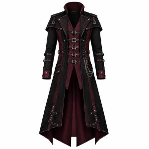 May include: A long black and deep red coat featuring a high collar, multiple silver-toned buckles down the front, and decorative straps on the sleeves and shoulders. The garment includes a silver chain detail and a high-low hemline design.