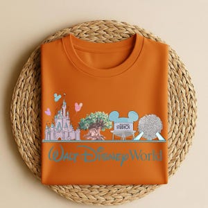 May include: A set of three ceramic mugs with a speckled, matte finish. The mugs are in shades of cream, light gray, and dark gray. Each mug has a simple, minimalist design, perfect for coffee or tea.