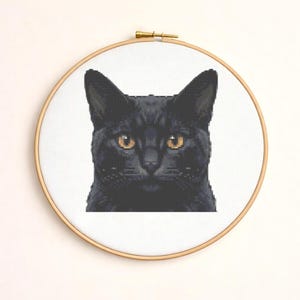 May include: A set of three ceramic mugs with a speckled, matte finish. Each mug features a different color: light blue, cream, and gray. The mugs have a simple, modern design and a comfortable handle.