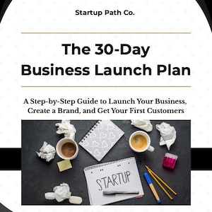 May include: A promotional image for "The 30-Day Business Launch Plan" by Startup Path Co. The image features a notebook with "STARTUP" written on it, coffee cups, pencils, and crumpled paper, suggesting a business or entrepreneurial theme.