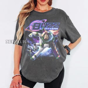 May include: A white ceramic mug with a black handle and the text "But First, Coffee" in a bold, black font. The mug is likely 310-425 ml in size, ideal for a morning beverage. The design is simple and modern.