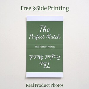 May include: A rectangular green card with white borders featuring the text The Perfect Match printed in white script. The text appears in three orientations, including one upside down, with the phrase Free 3-Side Printing above the card.