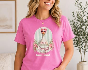 Maglietta "Lei è vestita di forza e dignità", maglietta cristiana con oca divertente, maglietta per donne di fede, maglietta regalo religiosa, maglietta floreale boho