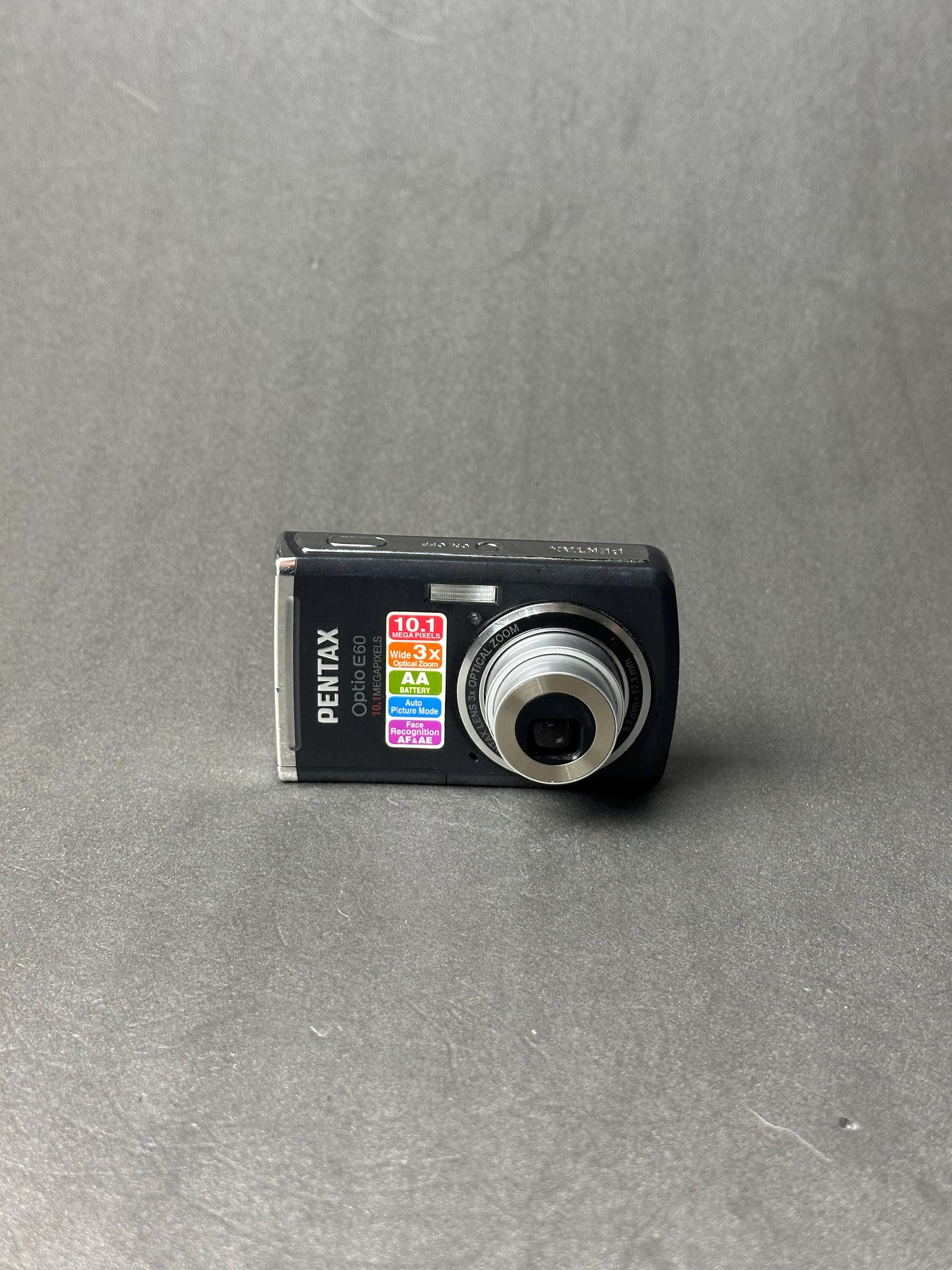 Pentax Optio E60 Digital Camera 10MP Compact Point and Shoot AA