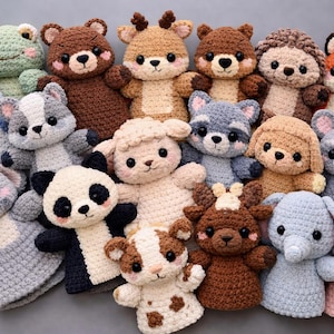 May include: A selection of handmade crochet animal plush toys, featuring a frog, bear, deer, fox, and other creatures. Each toy has detailed stitching and cute expressions. The colour scheme includes green, brown, grey, and pink.