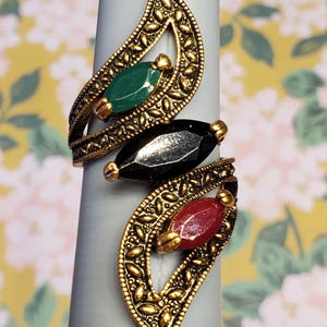 May include: A white ceramic mug with a black handle and the text "But First, Coffee" in a black, handwritten-style font. The mug is likely 11-15 ounces in size, perfect for a morning beverage.