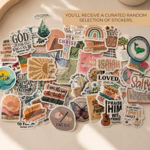 May include: A collection of assorted vinyl stickers featuring various religious quotes, floral illustrations, rainbows, and nature motifs. The stickers display text such as If God Is For Us, Let Your Light Shine, and Praise Him With Strings.