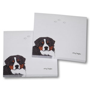 May include: Two stacks of white notepads with a Bernese Mountain Dog illustration on each. The dog is brown, black, and white with a white background. The text "art by SallyJean" is at the bottom of the notepad.
