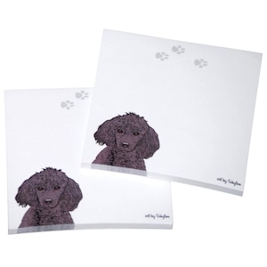 May include: Two white notepads with black paw prints and a black poodle illustration. The notepads have the text "art by SallyJo" at the bottom.