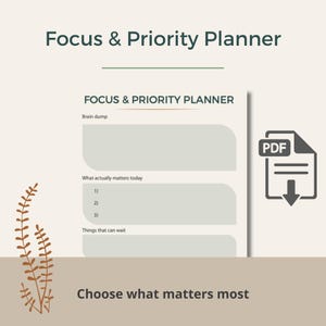 May include: A white ceramic mug with a black handle and the text "But First, Coffee" in a bold, black font. The mug is on a wooden surface.