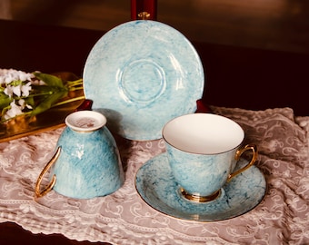 Juego de taza y platillo Royal Albert Gossamer de porcelana fina azul y dorada, fabricado en Inglaterra. Juego de 2 unidades.