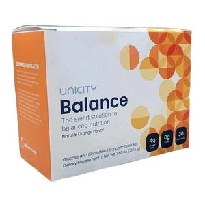 May include: A white and orange box of Unicity Balance drink mix. The box features the text "Balance" and "The smart solution to balanced nutrition." It also lists "Natural Orange Flavor" and nutritional information. The net weight is 7.65 oz.